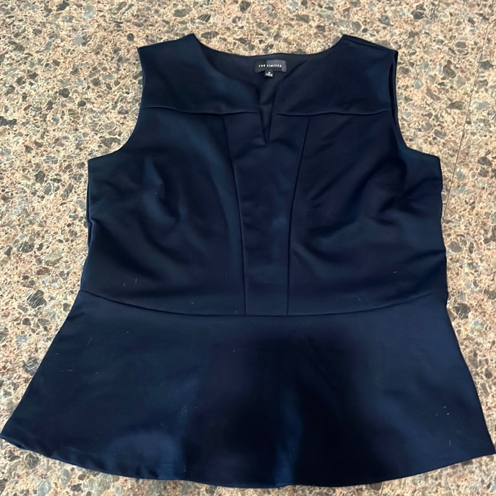 The limited sleeveless top size medium navy blue